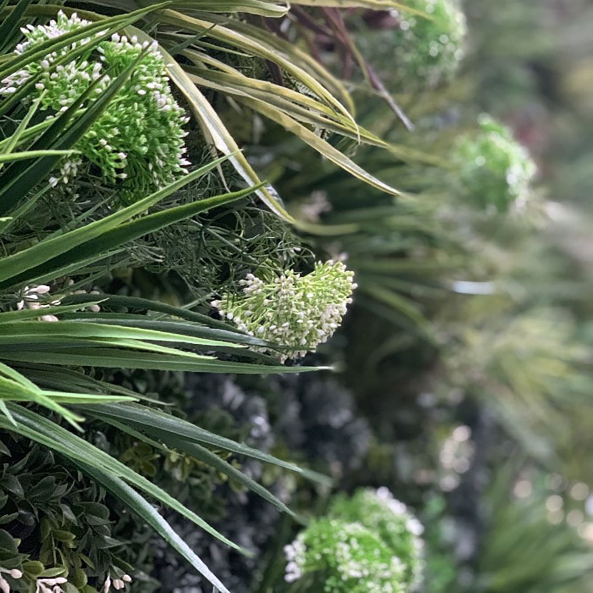 A Lovely mix of summer blossoms dotted with delicate white flowers. Incorporate these beautifully made plants where you please. They are designed to enhance or accent your wall by simply slotting them into the Vistafolia Panel where you want them.  Each Texture Box contains enough plants to personalise as many as 12 Vistafolia panels.
