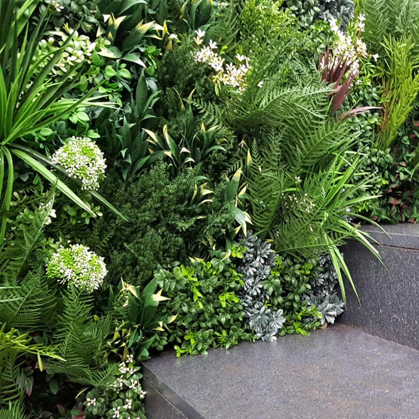 A Lovely mix of summer blossoms dotted with delicate white flowers. Incorporate these beautifully made plants where you please. They are designed to enhance or accent your wall by simply slotting them into the Vistafolia Panel where you want them.  Each Texture Box contains enough plants to personalise as many as 12 Vistafolia panels.